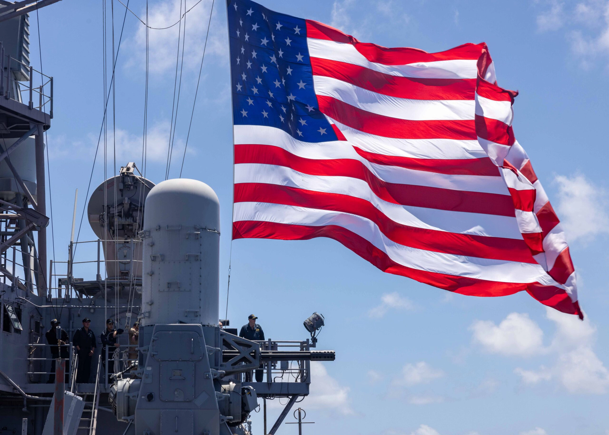 240607-N-DM318-1158 PHILIPPINE SEA (JUNE 7, 2024) The Ticonderoga-class guided-missile cruiser USS Robert Smalls (CG 62) flies its battle flag while operating in the Philippine Sea in support of Valiant Shield 2024, June 7, 2024. Exercises such as Valiant Shield allow the Indo-Pacific Command Joint Forces the opportunity to integrate forces from all branches of service and with our allies to conduct precise, lethal, and overwhelming multi-axis, multi-domain effects that demonstrate the strength and versatility of the Joint Force and our commitment to a free and open Indo- Pacific. (U.S. Navy photo by Mass Communication Specialist 2nd Class Ange Olivier Clement)